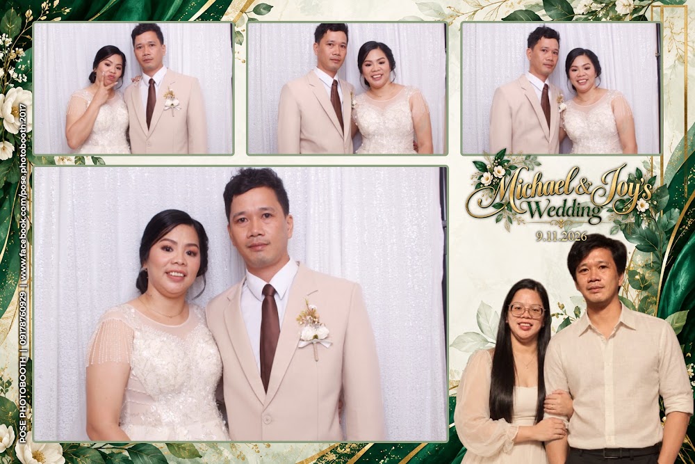 Wedding guests posing at Michael and Joy’s photobooth